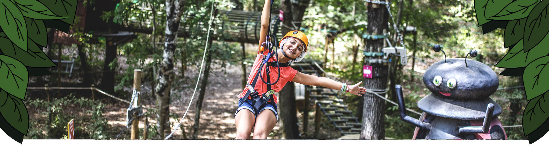 Young girl on a zip line with her arms outstretched